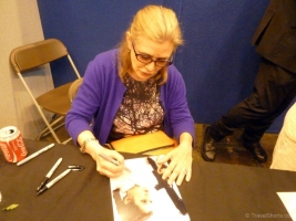 Carrie Fisher signing autographs at London Film and Comic Con 2014 06